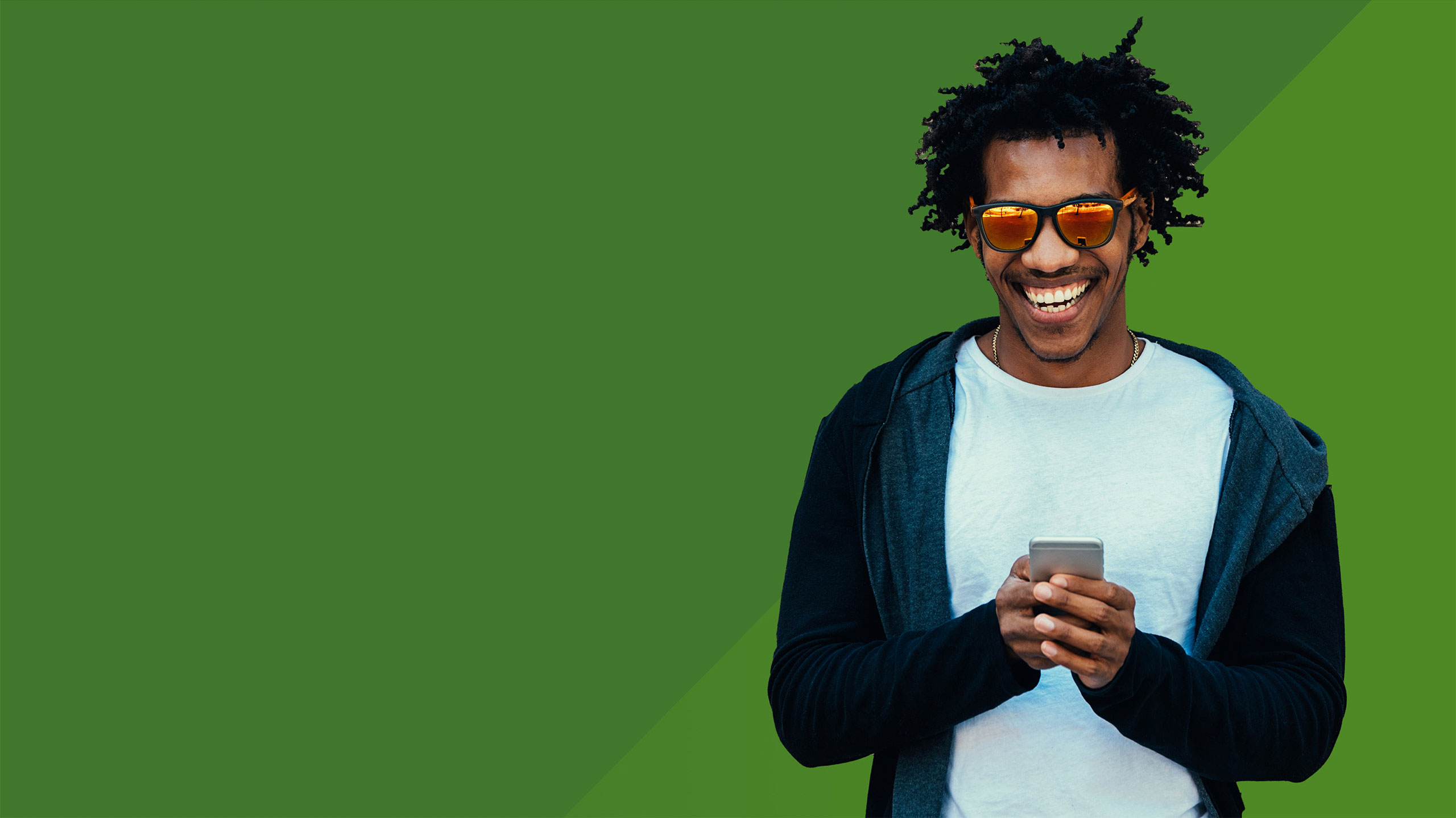 smiling man holding a phone